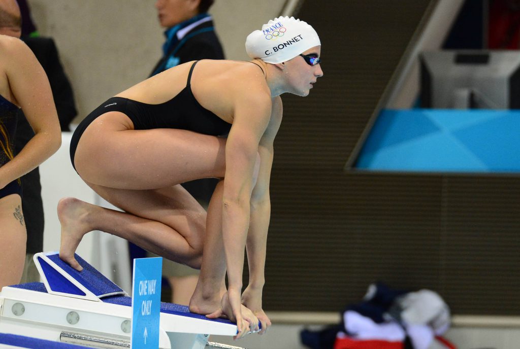 Jul 29, 2012; London, United Kingdom; Charlotte Bonnet (FRA) prepares to dive off the starting blocks in a warm up session during the London 2012 Olympic Games at Aquatics Centre. Mandatory Credit: Kyle Terada-USA TODAY Sports