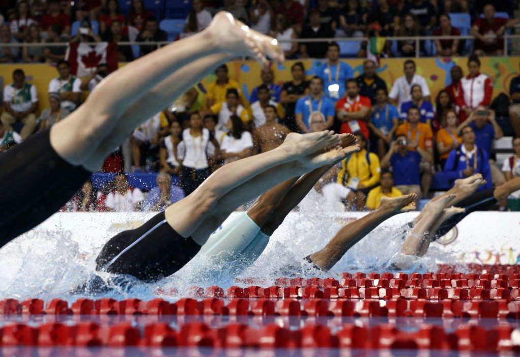 Jul 17, 2015; Toronto, Ontario, CAN; A view of the feet of the competitors as they dive in at the start of the women's 50m freestyle final the 2015 Pan Am Games at Pan Am Aquatics UTS Centre and Field House. Mandatory Credit: Rob Schumacher-USA TODAY Sports