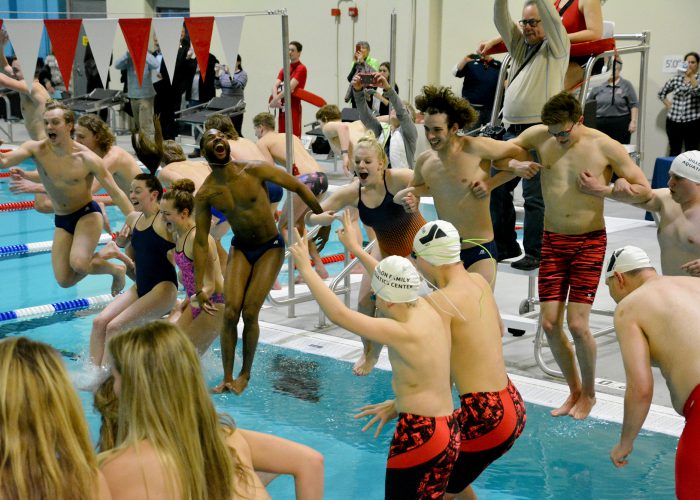 Members of the Midland University Swimming Team join others in diving into the new pool at the Dillon Family YMCA Aquatic Center on Tuesday, Feb. 6, in Fremont, Nebraska.