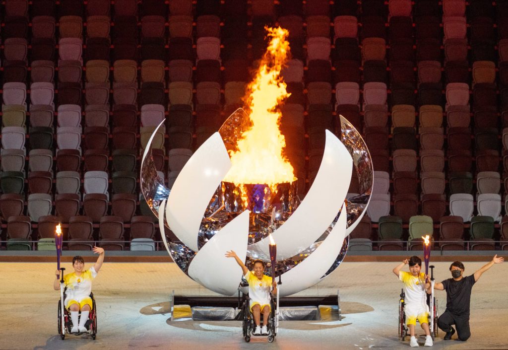 Aug 24, 2021; Tokyo, Japan; Torchbearers Yui Kamiji JPN (Wheelchair Tennis), Shunsuke Uchida JPN (Boccia) and Karin Morisaki (Paralympic Powerlifting) light the Paralympic flame in the Olympic Stadium during the Opening Ceremony for theTokyo 2020 Paralympic Games. Mandatory Credit: Bob Martin/OIS Handout Photo via USA TODAY Sports